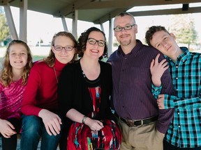 Thereisa and Chris Reid pose for a photo with their children Sydney, left to right, Danica and Aiden in this undated handout photo. Thereisa Reid wants remote learning options for her three children to protect their father, Chris Reid, from COVID-19 as he is in remission with testicular cancer, or he may have to move in with his parents.