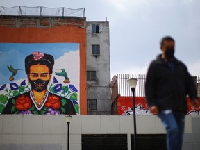 A mural of iconic Mexican artist Frida Kahlo wearing a face mask is pictured on Sept. 24, 2020, as the COVID-19 pandemic rages on in Mexico City.