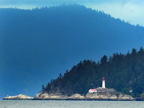 Lighthouse Park as seen from Spanish Banks in Vancouver.