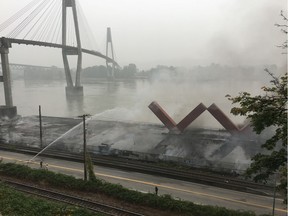 A huge fire destroyed the pier on New Westminster's waterfront on Sept. 13. City officials say it will reopen on Friday.