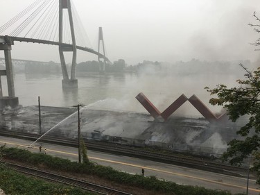 Fire crews still on the scene of a fire that  broke out at the New Westminster Pier yesterday. A huge fire destroyed the pier on New Westminster's waterfront. Firefighters from New Westminster, Coquitlam, Delta & Vancouver including their Fireboats. No reports of injuries or a cause of the fire yet.