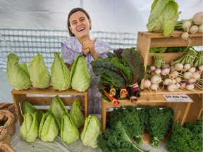 Seasonal worker Grace Wampold is at the Tsawwassen First Nation Farm School stand selling vegetables at the Main Street Station Farmers Market in Vancouver on Sept. 23.