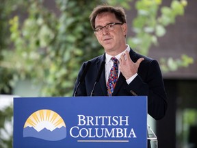 B.C. Health Minister Adrian Dix was leading the cheers for public health care on Thursday after a court upheld the provincial ban on extra billing and other restrictions on access to private health clinics.