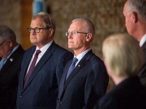 Doug Donaldson, British Columbia's minister of Forests, stands next to federal and provincial ministers after their meeting to discuss wildfire response in Vancouver, B.C., on Tuesday September 5, 2017.
