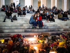 People gather outside of the U.S. Supreme Court following the death of U.S. Supreme Court Justice Ruth Bader Ginsburg, in Washington, D.C. on Sept. 19, 2020.