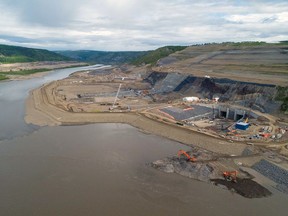 The dam site for the Site C hydroelectric project, pictured in June. Originally estimated to cost $6 billion, that Site C figure was revised to $10.7 billion last March, at which time more than $5 billion had already been spent.