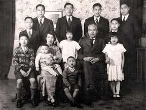 Brandt C. Louie's grandparents, Hok Yat Louie and Young Shee, with their children in 1933. Brandt's father Tong Louie is pictured in the back row, top left. Submitted Photograph by H.Y. Louie Family Co.