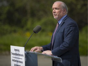 Premier John Horgan announcing highway improvements during an appearance in Langley last year.