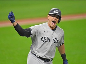 Gio Urshela of the New York Yankees celebrates after hitting a grand slam during Game 2 of the American League Wild Card Series at Progressive Field on Sept. 30 in Cleveland, Ohio.