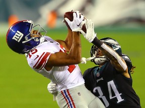 Golden Tate of the New York Giants catches a touchdown pass against Cre'von LeBlanc of the Eagles at Lincoln Financial Field on Oct. 22 in Philadelphia.