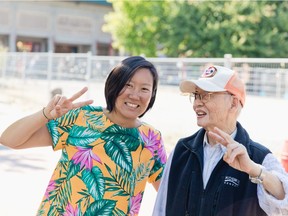 Community organizer Doris Chow and senior Jack Poon in Vancouver's Chinatown. Chow was part of linking seniors such as Poon to authors of a book highlighting the fun fashions and lives of Chinese seniors in cities across North America. Photo: Andria Lo, Chinatown Pretty
