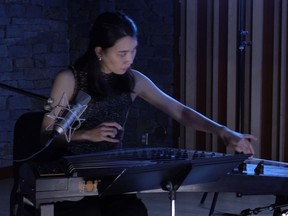 Tai-Lin Hsieh plays the zheng in a filmed performance that is part of Global Soundscapes, which runs Nov 5-26.