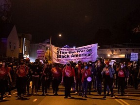 Protesters march through West Philadelphia on October 27, 2020, during a demonstration against the fatal shooting of 27-year-old Walter Wallace, a Black man, by police.