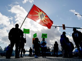 Supporters of the Wet'suwet'en Nation's hereditary chiefs block the Pat Bay highway as part of protests against the Coastal GasLink pipeline, in Victoria, early this year.