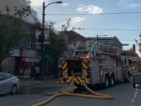 Vancouver firefighters are battling a three-alarm blaze at a commercial strip on Main Street near Broadway.