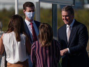 Senator David Perdue (R-GA) greets supporters at a campaign rally on October 16, 2020 in Macon, Georgia.