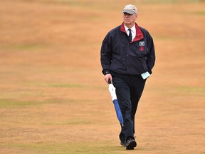 In this file photo taken on July 20, 2018 Britain's Prince Andrew walks up a fairway during the Open Championship at Carnoustie, Scotland.