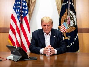 This handout photo released by the White House shows U.S. President Donald Trump on Oct. 4, 2020, in his conference room at Walter Reed National Military Medical Center in Bethesda, Maryland.