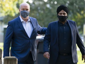 NDP Leader John Horgan arrives with local candidate Aman Singh prior to making a seniors announcement in Queensborough on Oct. 14, 2020.