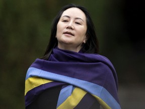 Meng Wanzhou, chief financial officer of Huawei, leaves her Vancouver home for court on Wednesday, Oct. 28, 2020.