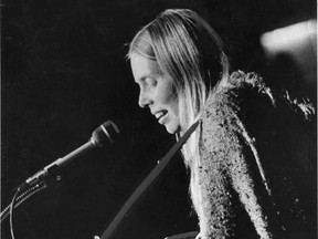 Joni Mitchell performs at the Greenpeace Benefit Concert on Oct. 16, 1970.