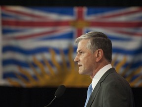 In this file photo, B.C. Liberal Leader Andrew Wilkinson laughs after taking a questions from a reporter.