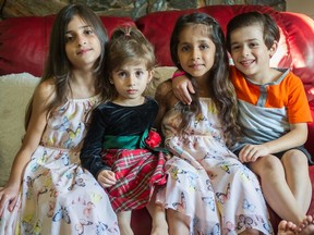 From left, Zana, 8, Layan, 3, Zahar, 7, and Mohammad, 5, at their home in Surrey.