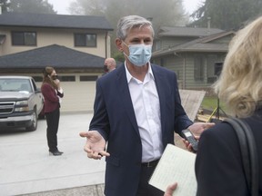 B.C. Liberal leader Andrew Wilkinson talks with Vancouver Sun reporter Lori Culbert in Maple Ridge on Oct. 6, 2020.