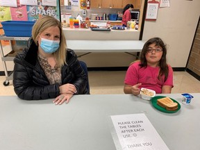 Child care worker Amy Lauwers serves up breakfast at Prince Charles Elementary school in North Surrey, one of the more than 100 schools seeking help from The Vancouver Sun's Adopt-A-School campaign.