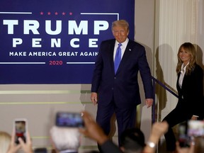 U.S. President Donald Trump and first lady Melania Trump take the stage late on election night in the East Room of the White House on Nov. 4, 2020 in Washington, D.C. Trump took to the podium with the election still too close to call.