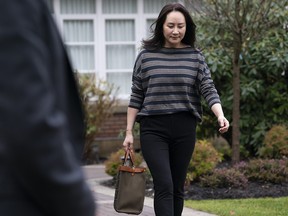 Chief financial officer of Huawei, Meng Wanzhou, leaves her home in Vancouver on Wednesday, Nov. 25, 2020. Wanzhou is heading to the British Columbia Supreme Court for an evidentiary hearing in her extradition case.