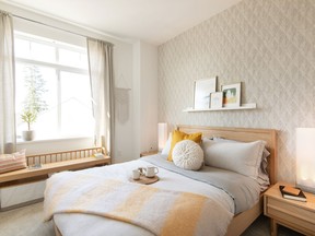 Sunshiny yellow accents brighten the guest bedroom at Woodbridge Homes’ Rocklin on the Creek development in Coquitlam.