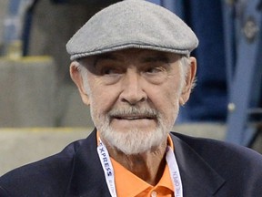 In this file photo taken Sept. 6, 2013, Sean Connery watches Russian tennis player Mikhail Youzhny against Serbia's Novak Djokovic during their 2013 U.S. Open men's singles match at the USTA Billie Jean King National Tennis Center in New York City.