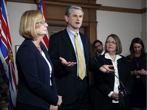 Former Liberal leader Andrew Wilkinson is joined by MLA's Shirley Bond, right, and Tracy Redies during a press conference following the budget speech in Victoria on Feb. 19, 2019.