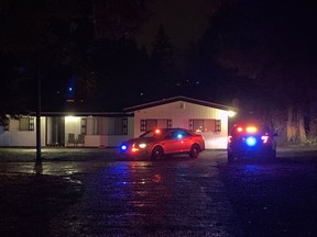 Police at the Hells Angels Hardside clubhouse in Surrey on Friday night. Kim Bolan photo