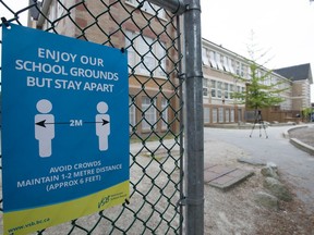 A physical distancing sign is seen during a media tour of Hastings Elementary school in Vancouver on September 2, 2020.