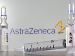 FILE PHOTO: A test tube labelled with the word Vaccine is seen in front of AstraZeneca logo in this illustration taken, September 9, 2020. REUTERS/Dado Ruvic/Illustration/File Photo