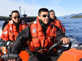 Numuch Keitlah (left) and Jake Thomas (centre) take part in a Coastal Nations search and rescue exercise off the coast of Vancouver Island in an undated handout photo.