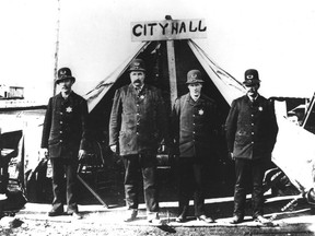 After the fire of 1886, the Vancouver Police Department poses in front of the makeshift city hall at Carrall and Water Streets, which doubled as the police station. (left to right) Cons. Jackson T. Abray, Chief J.M. Stewart, V.W. Haywood, and Deputy Chief John McLaren. Vancouver Archives LGN 457