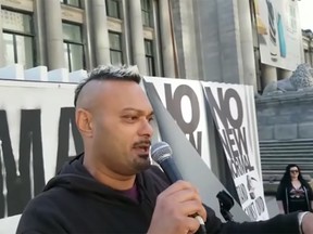 Makhar Singh Parhar speaks at an anti-mask rally in downtown Vancouver.