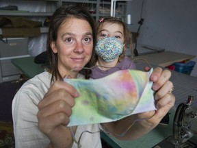Stephanie Schneider and her daughter Wallis Fleming, 3, at Schneider's studio space making COVID-19 face masks on Nov. 4.