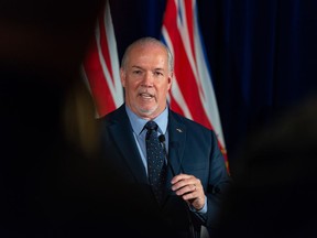 Premier John Horgan, whose government is under fire for cutting monthly COVID-19 supplements to people on income assistance and disability, suggested Monday the reduction may be temporary until rates rise in April.