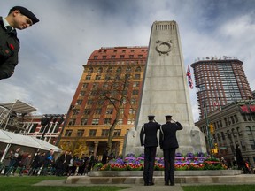 Salutes at the cenotaph during the Remembrance Day ceremony at Victory Square in Vancouver last year.