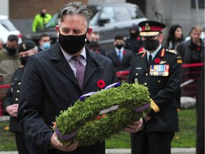 File photo of Vancouver Mayor Kennedy Stewart prepares to lay a wreath at the 2020 Remembrance Day ceremony at the Cenotaph at Victory Square, in Vancouver, BC., on Nov. 11, 2020.