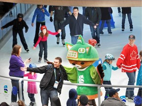 People enjoy some last minute Olympic and Paralympic festivities in downtown Vancouver on the final day, Sunday, March 21, 2010.