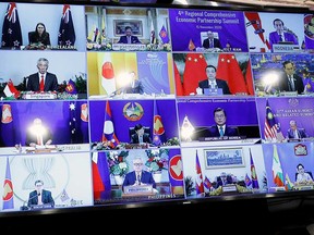 ASEAN leaders are seen on a screen as they attend the 4th Regional Comprehensive Economic Partnership Summit as part of the 37th ASEAN Summit in Hanoi, Vietnam on Sunday.