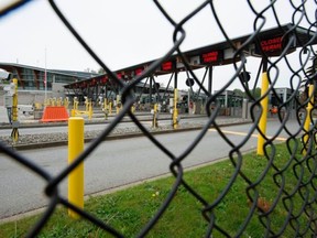 Part of Canada's land border with the United States is pictured closed at the Peace Arch border crossing in Surrey, B.C., Tuesday, April 28, 2020. An Oak Bay man has been fined $1,150 under the Quarantine Act, invoked in order to limit the spread of COVID-19.