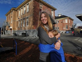 Seymour Elementary teacher Carrie Gelson gets a hug from Grade 2 student Violet Smatlan outside the Vancouver school on October 25, 2012. Gelson made a plea in 2011 on behalf of her needy inner-city students.