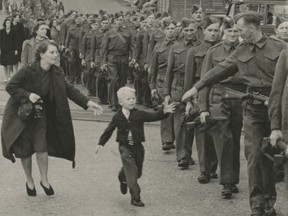 The famous Wait for Me Daddy photo: The soldier at the front of the line behind the little boy Warren "Whitey" Bernard is Harry Campbell, with the strap of his weapon tight across his uniformed chest. Campbell's wife, Sophie, can be seen across from him, behind Warren's mom, Bernice. Claude Dettloff's famous photo depicted young Bernard running after his father. Pte. Jack Bernard, as the British Columbia regiment left its New Westminster barracks On Oct. 1, 1940 to board a troop ship for a training camp in Nanaimo.