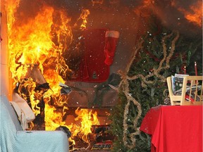 Fire from a fireplace consumes a room during a holiday safety live fire demonstration on Dec. 9, 2010 in Menlo Park, California.